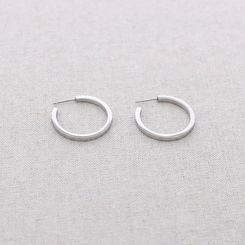 Boucles d'oreilles plates en acier
