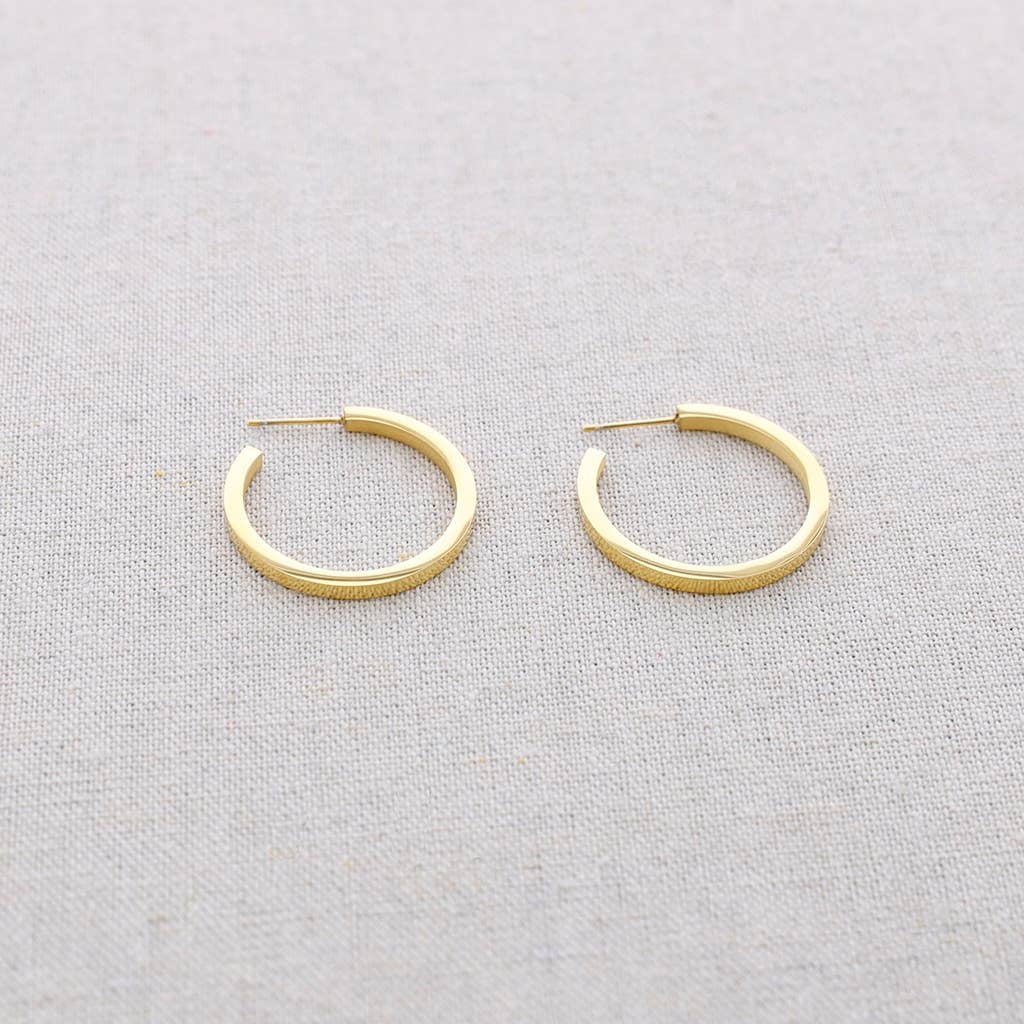 Boucles d'oreilles plates en acier