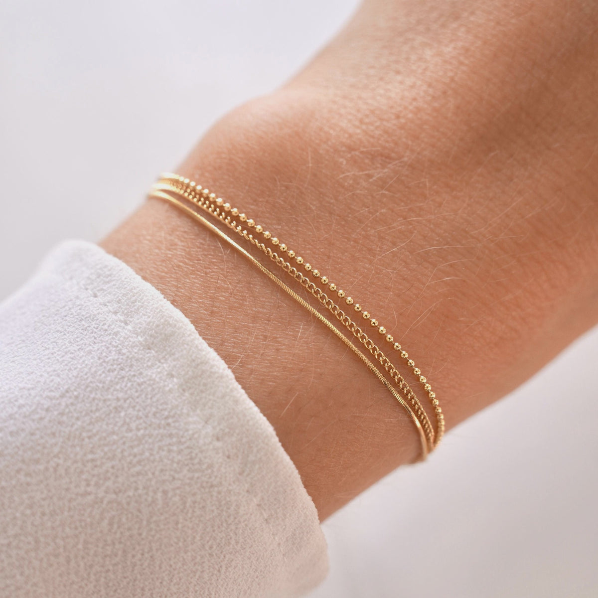 Armband met 3 fijne kettingen Goud